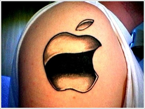 Grey Ink Apple Tattoo On Man Right Shoulder