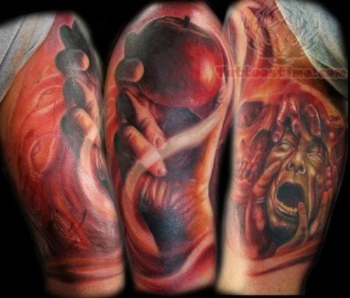 Red Apple In Hand Tattoo