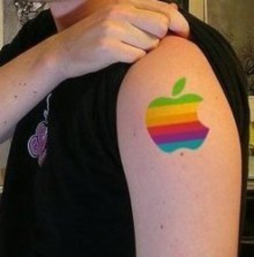 Colored Ink Apple Tattoo On Bicep