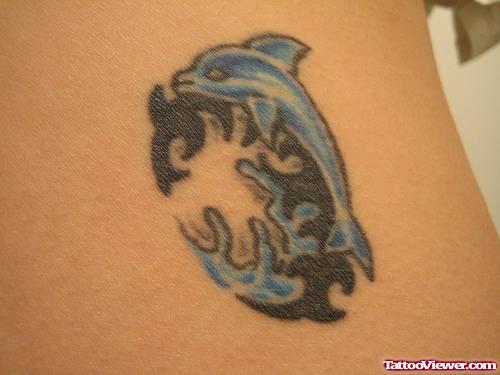 Black Tribal And Blue Dolphin Aqua Tattoo