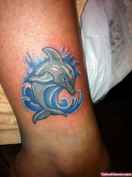 Grey Ink Dolphin Aqua Tattoo On Leg