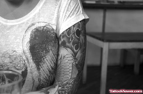 Grey Ink Aqua Tattoo On Left Sleeve