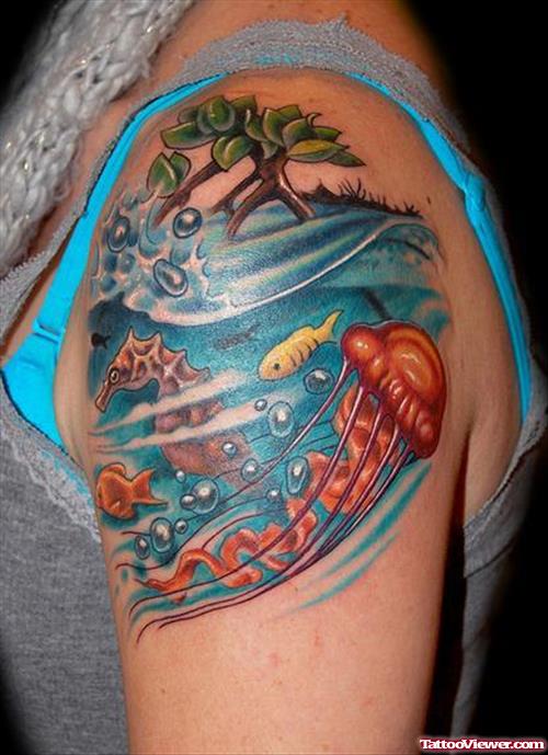 Colored Aqua Tattoo On Left Shoulder