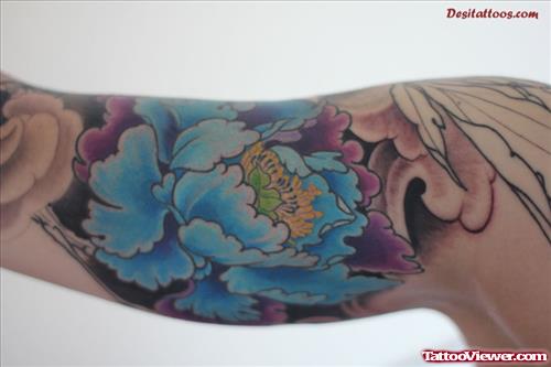 Awesome Aqua Blue Flower Tattoo On Bicep