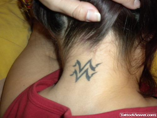 Girl Showing Her Aquarius Tattoo
