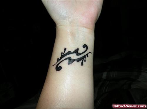 Black Ink Aquarius Tattoo Left Wrist
