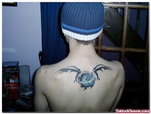 Tribal Aquarius Tattoo On Man Upperback
