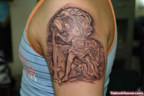 Grey Ink Aquarius Tattoo On Left Shoulder