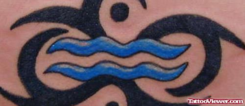 Black Ink Tribal And Blue Ink Aquarius Tattoo