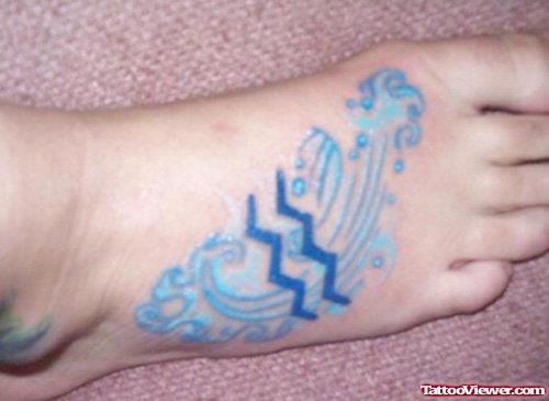 Blue Ink Aquarius Tattoo On Right Foot