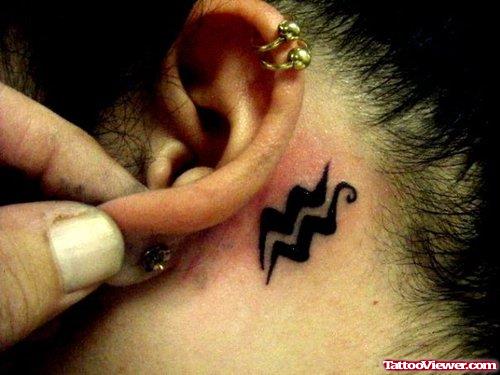 Aquarius Sign Tattoo Behind Ear