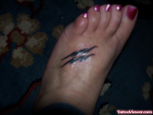 Aquarius Tattoo On Girl Left Foot