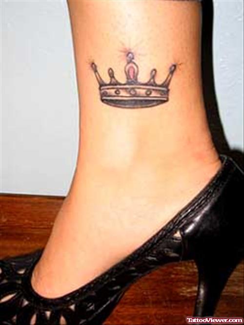 Grey Ink Crown Arabic Tattoo On Ankle