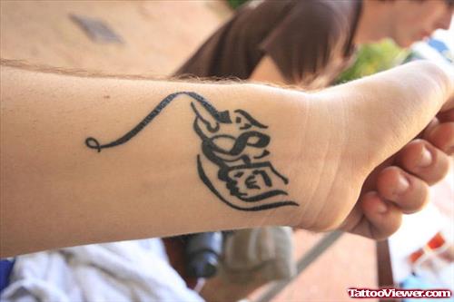Latest Arabic Tattoo On Left Wrist