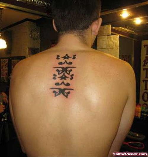 Arabic Tattoo On Man Upperback