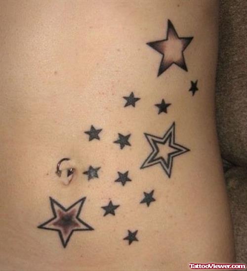 Grey Ink Stars Arabic Tattoo On Hip