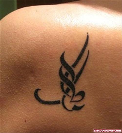 Black Ink Tribal Arabic Tattoo On Back