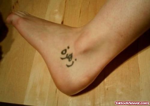 Arabic Tattoo On Left Ankle