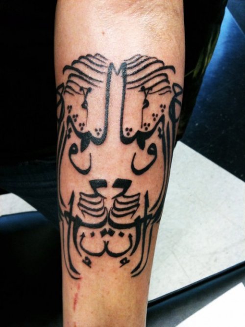 Black Ink Arabic Lion Head Tattoo On Sleeve