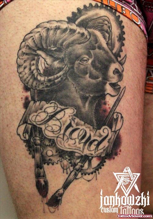 Grey Ink Banner And Aries Head Tattoo