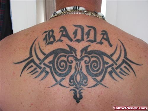 Tribal And Aries Tattoo On Upperback