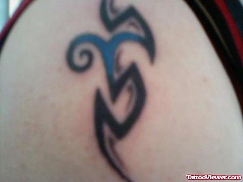 Black Tribal And Blue Aries Zodiac Tattoo