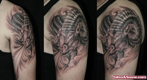 Grey Ink Aries Tattoo On Left Shoulder