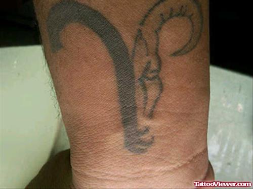 Grey Ink Aries Head Tattoo