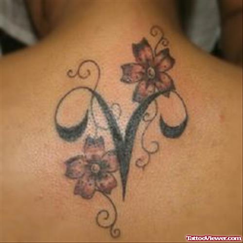 Flowers and Aries Tattoo On Upperback