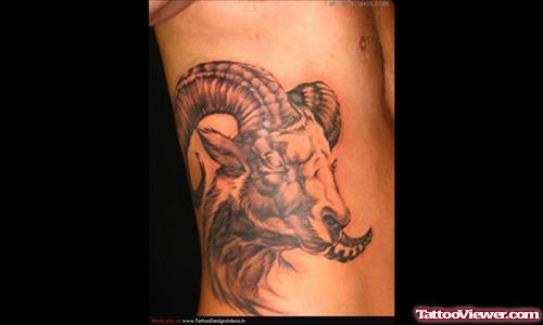 Grey Ink Goat Head And Aries Tattoo On Side Rib