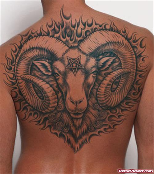 Grey Ink Gota Head And Aries Tattoo On Back Body