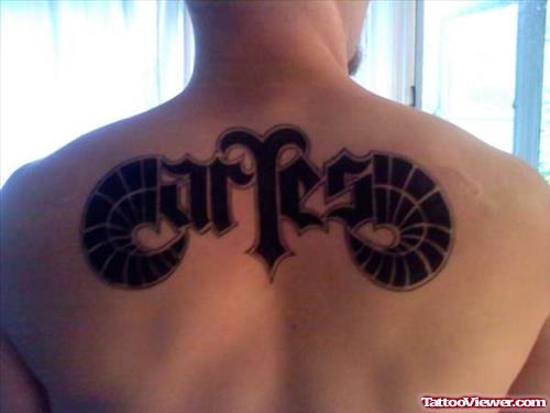 Black Ink Aries Tattoo On Man Upperback