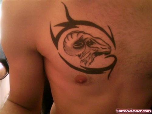 Black Tribal And Aries Tattoo On Man Chest