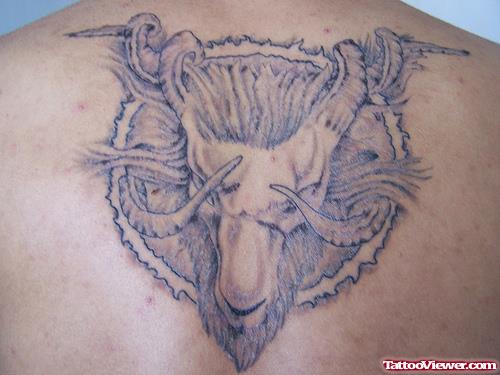 Amazing Grey Ink Aries Head Tattoo On Back