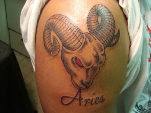 Red Eyes Aries Head Tattoo On Shoulder