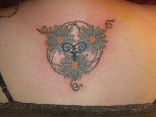Blue Flowers And Aries Tattoo On Back