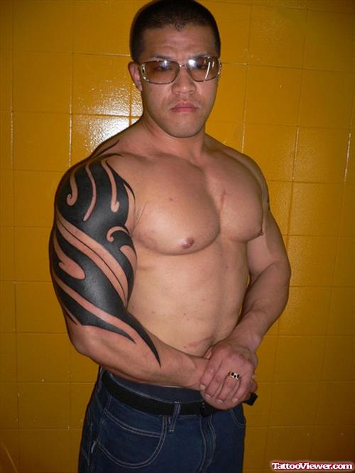 Man With Tribal Arm Tattoo