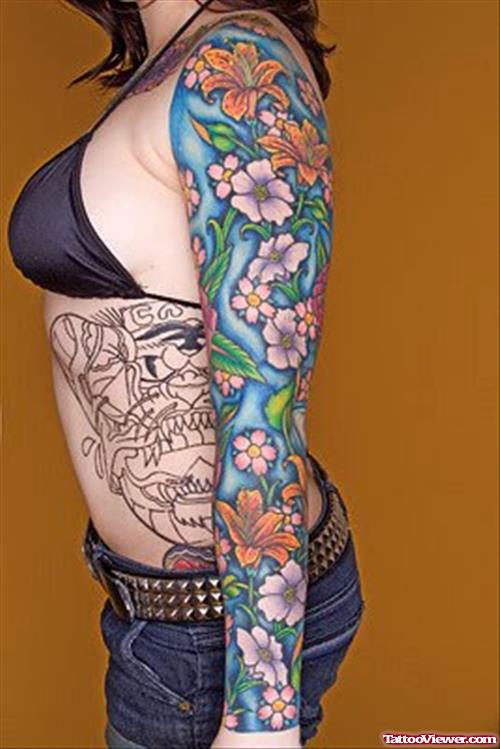 Colored Flowers Tattoos On Girl Left Arm