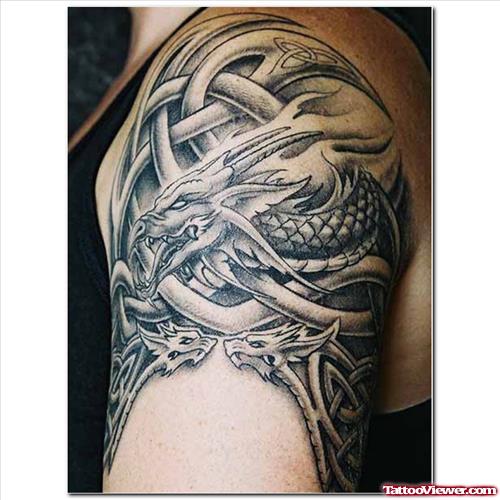 Grey Ink Tribal And Dragon Tattoo On Left Arm