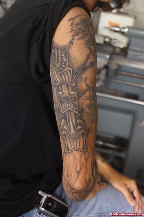 Grey Ink Tikki Tattoo On Right Arm