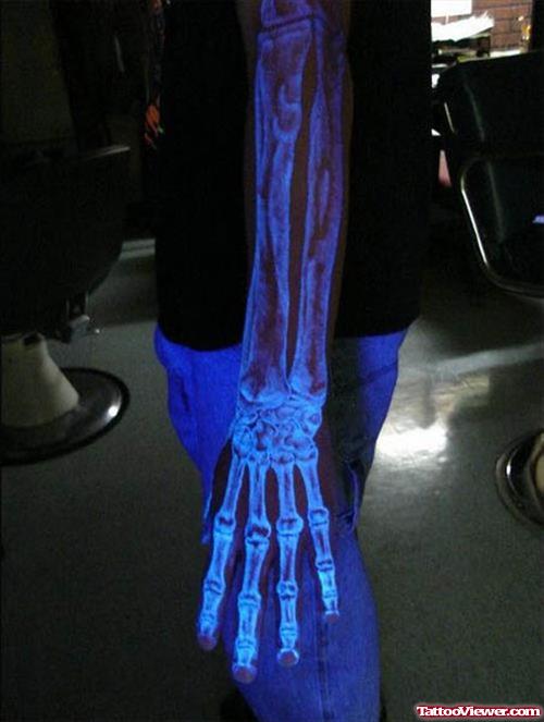 Black Light Skeleton Arm Tattoo