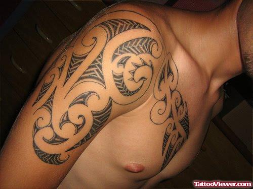 Polynesian Tattoo On Man Chest And Right Arm