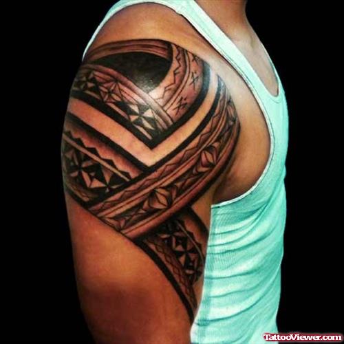 Grey Ink Tribal Tattoo On Man Right Arm