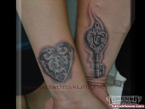 Grey Ink Heart And Key Tattoos On Both Arms