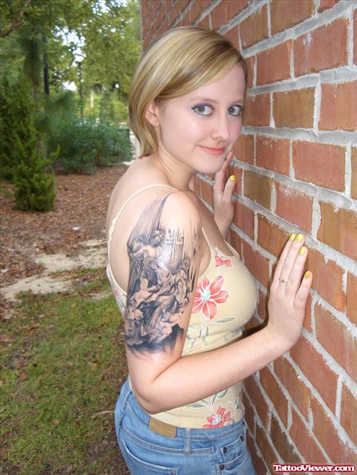 Grey Ink Cherub Angel Tattoo On Girl Right Arm