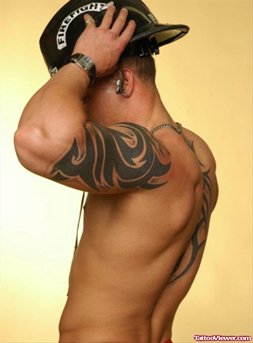 Nice Black Ink Tribal Tattoo On Left Arm