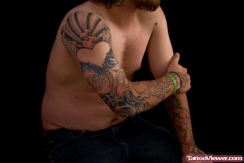 Heart Tattoo On Man Right Arm