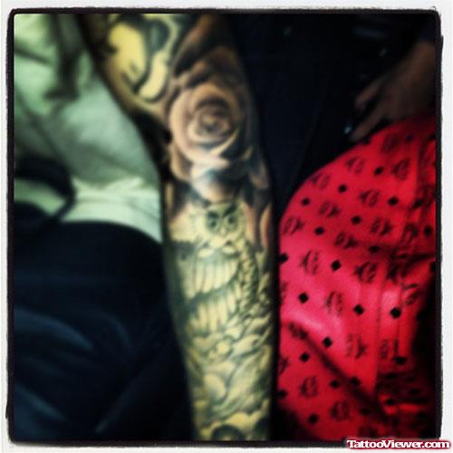 Grey Ink Rose Flower Tattoo On Left Arm