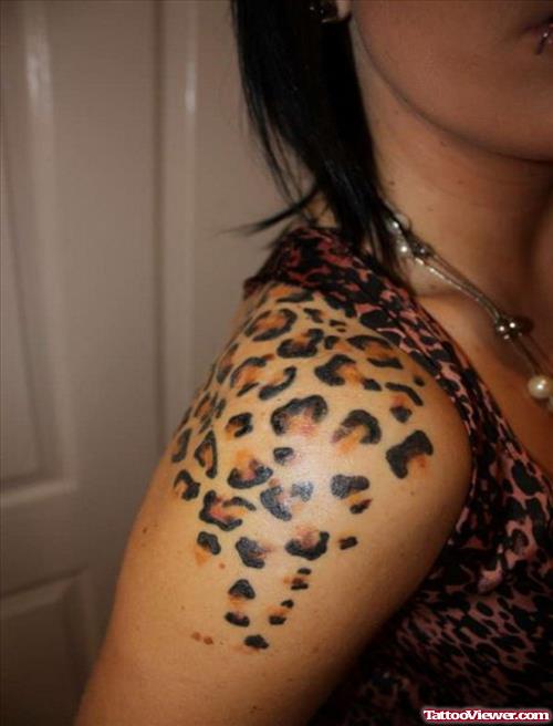 Colored Leopard Print Tattoo On Girl Right Arm