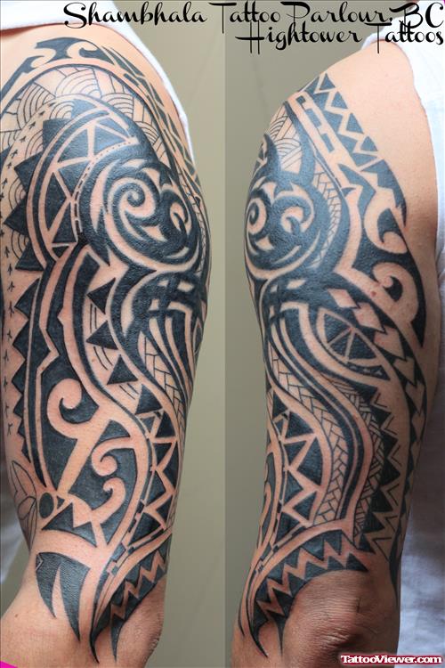 Black Ink Tribal Tattoo On Left Half Sleeve